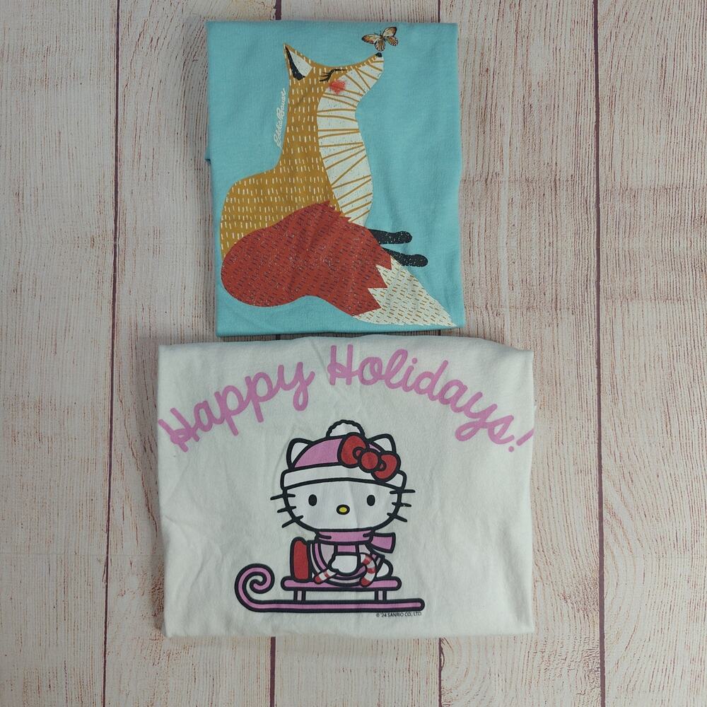 Pair of girls' graphic short sleeve t-shirts sz L (10/12)